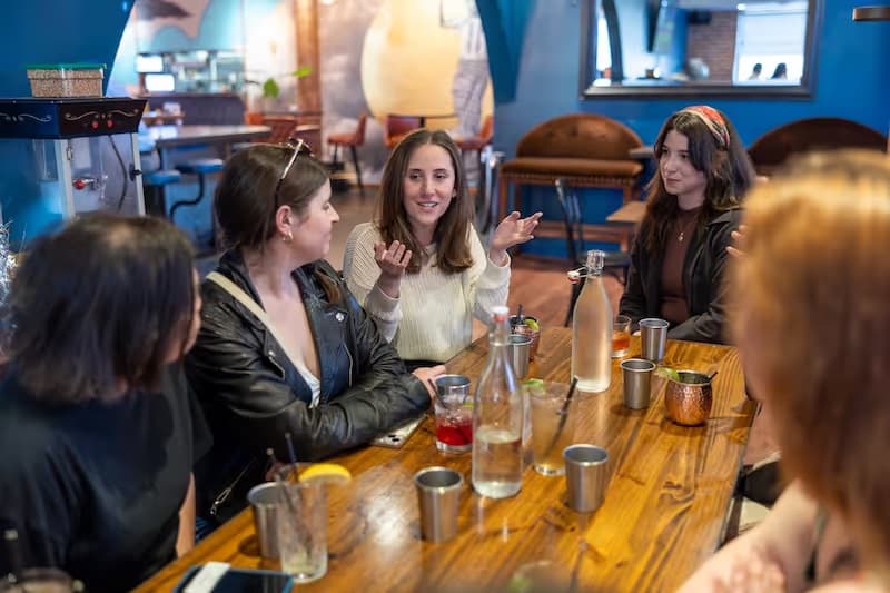 Group of women laughing together at a RealRoots meetup